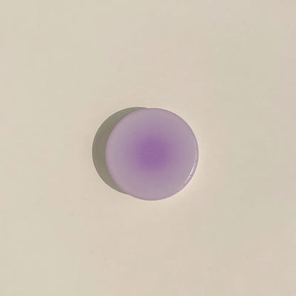 Yellow and purple gradient silicone iPhone case showing integrated airbag X bracket on the back.