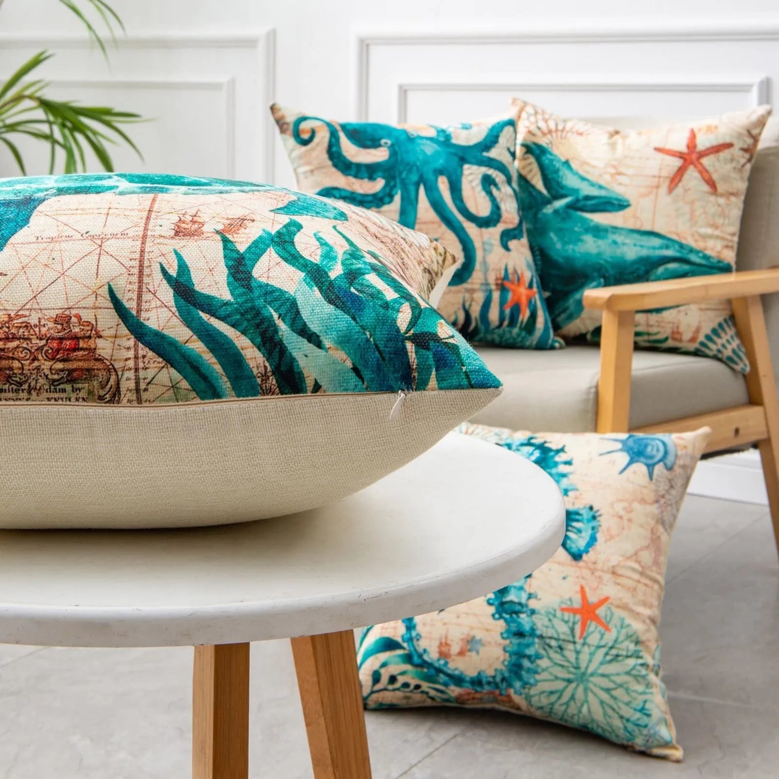 Linen cushion cover with detailed sea turtle pattern, showing invisible zipper closure.