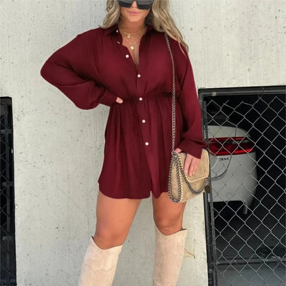 A stylish long sleeve jumpsuit with a button-up shirt design, available in a variety of vibrant colors.