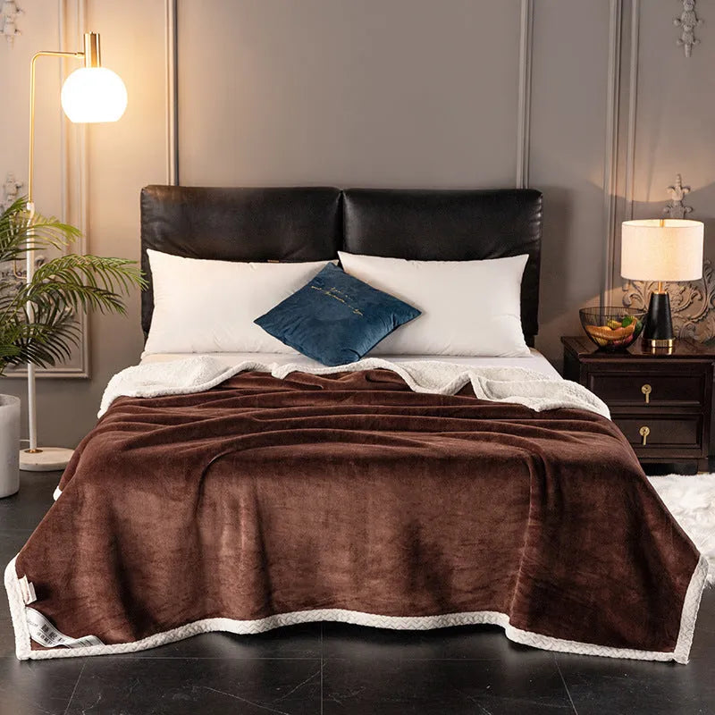 A thick, plain coral fleece blanket in a choice of colours, folded to show its texture.