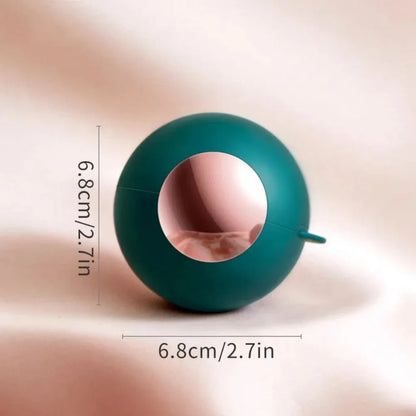 Washable reusable lint roller ball with handle for removing pet hair from fabrics.
