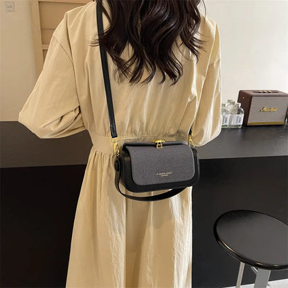 Women's PU leather messenger bag in a horizontal square shape with a lock and adjustable shoulder strap.