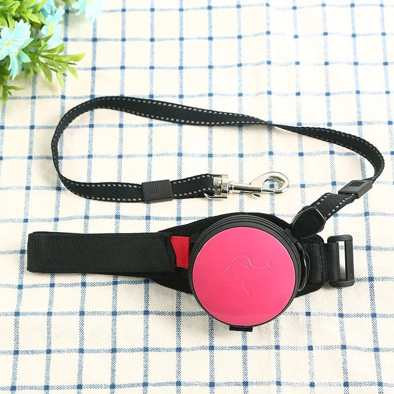 Retractable dog leash with handle and nylon cord in vibrant orange colour, extended to 3 metres.