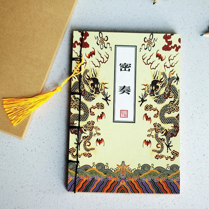 A5 antique wire-bound notebook with classical artwork cover, black oil wax rope binding, and decorative tassels