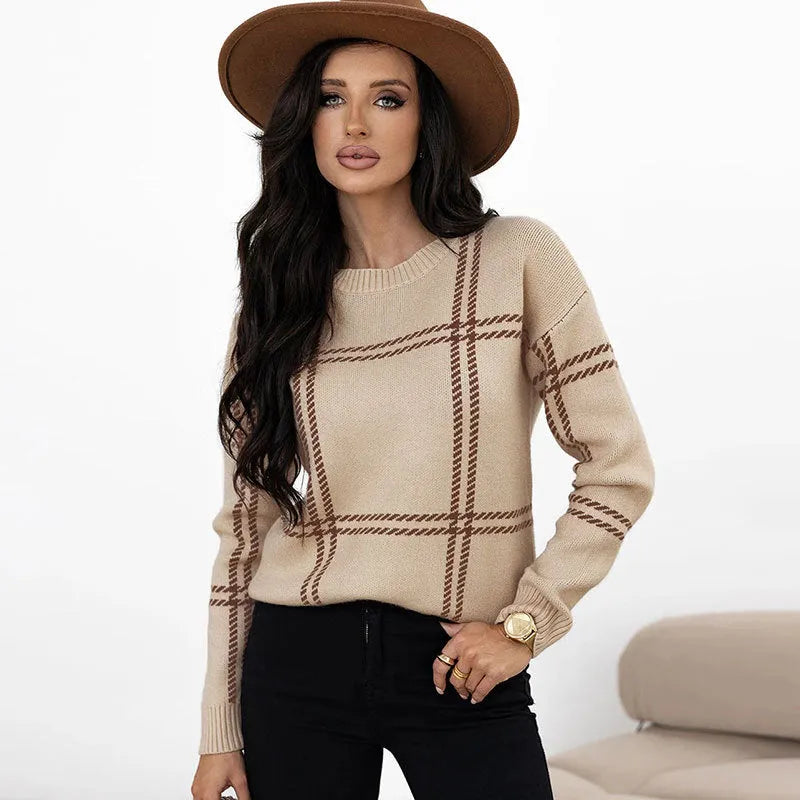 Women's loose-fitting plaid crew neck sweater with apricot, black, beige, red, and green colour-block stripes.