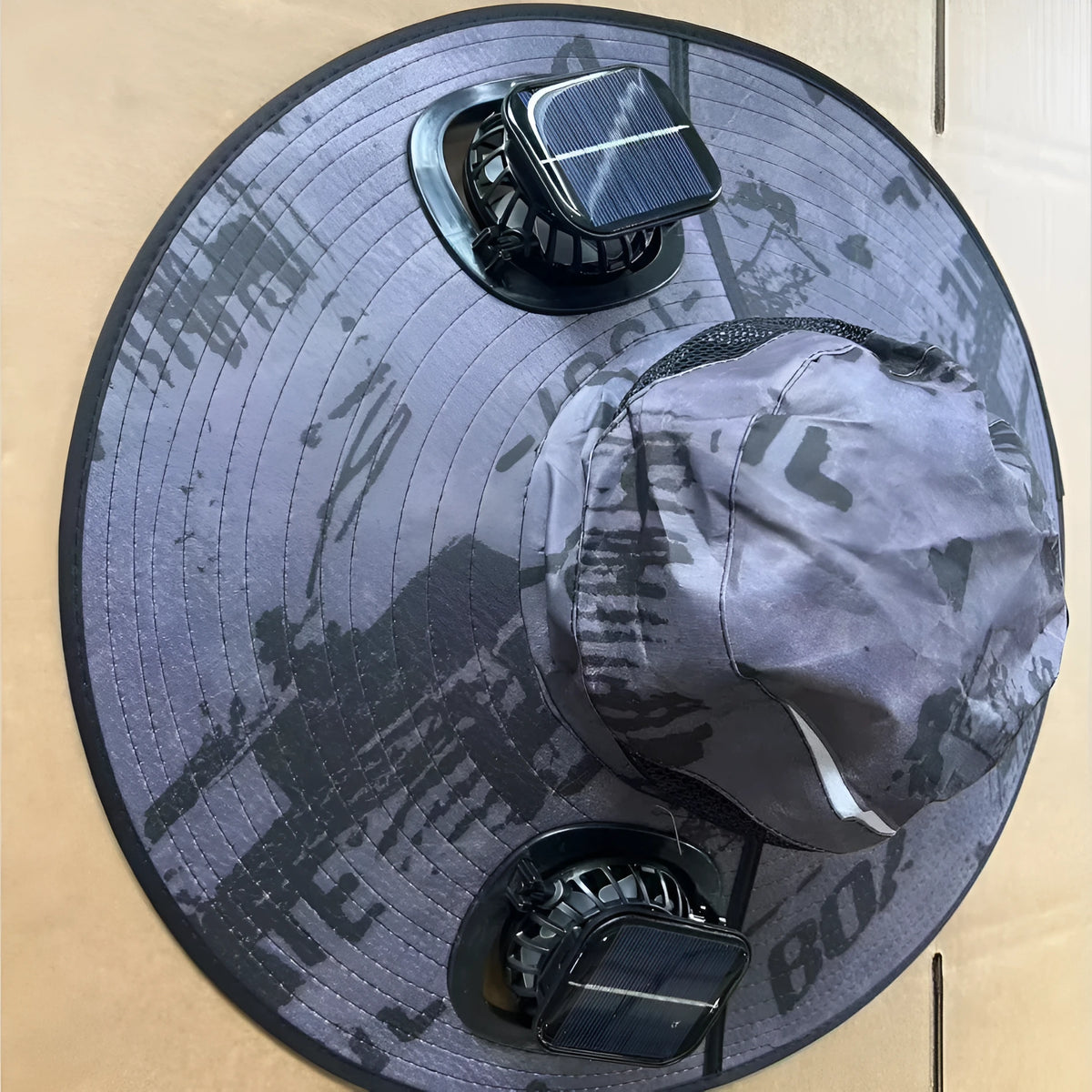 Men's grey solar fan cap with large peak and integrated cooling fans on the front.