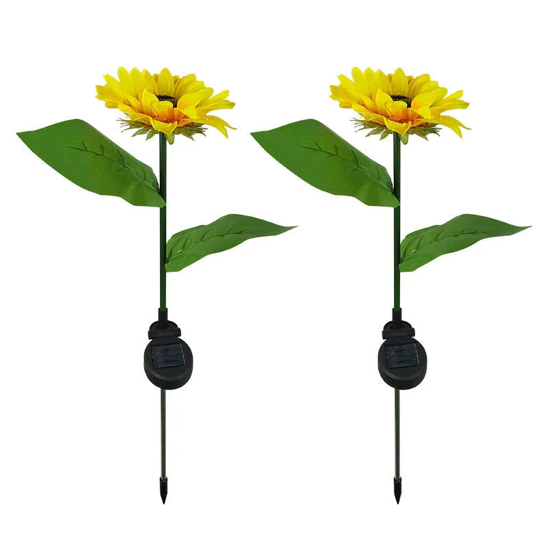 Elegant solar-powered sunflower lamps illuminating a serene outdoor garden pathway