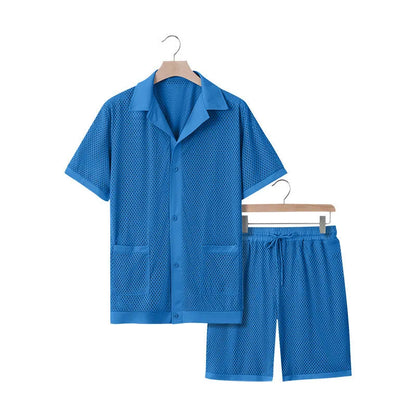 Light blue see-through beach shorts suit with matching cardigan on a summer background.