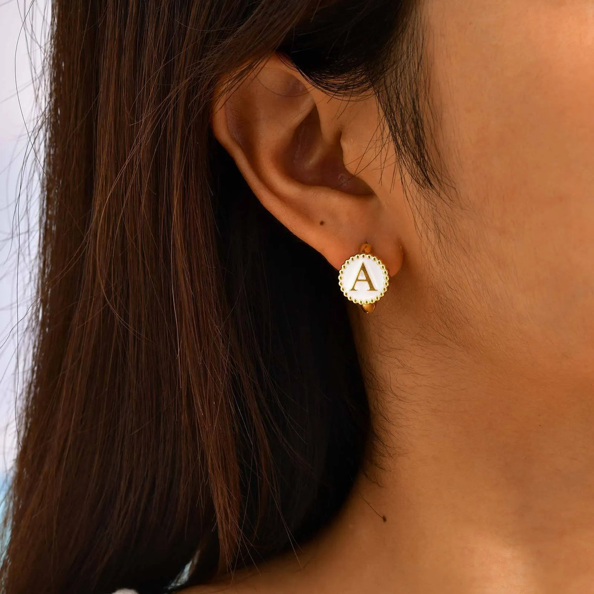 Round gold-tone letter earrings for women in stainless steel with electroplated finish, available in letters A to Z
