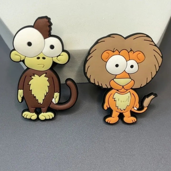 Nine PVC soft rubber cartoon animal fridge stickers including monkey, crocodile, leopard, lion, zebra, elephant, giraffe, and ostrich.