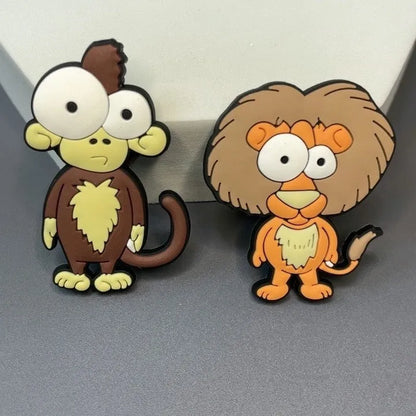 Nine PVC soft rubber cartoon animal fridge stickers including monkey, crocodile, leopard, lion, zebra, elephant, giraffe, and ostrich.