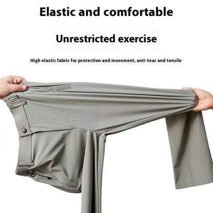 Man wearing black Ice Silk loose-fit casual trousers with an elastic waistband.