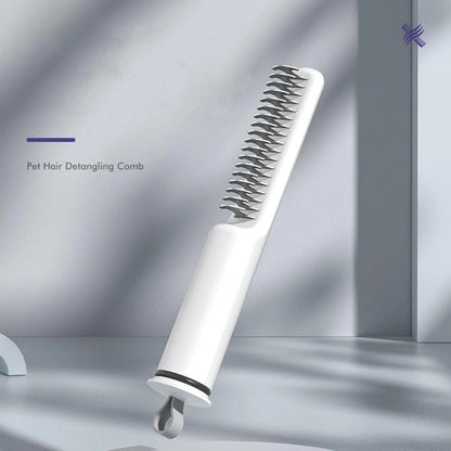 Pink and white stainless steel dematting comb for dogs on a plain background.