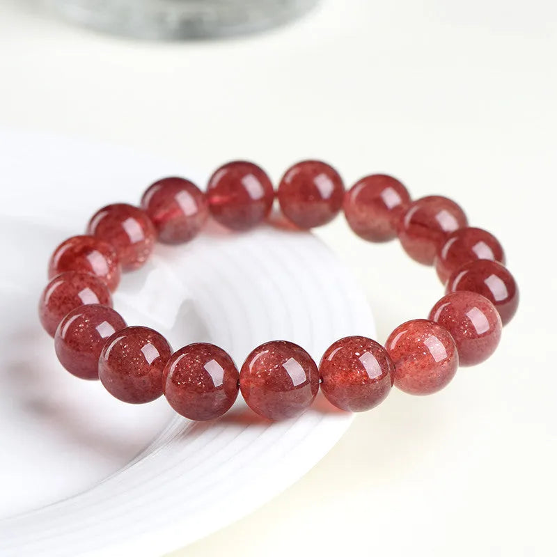 Natural strawberry quartz bracelet with geometric beads in starlight red colour.