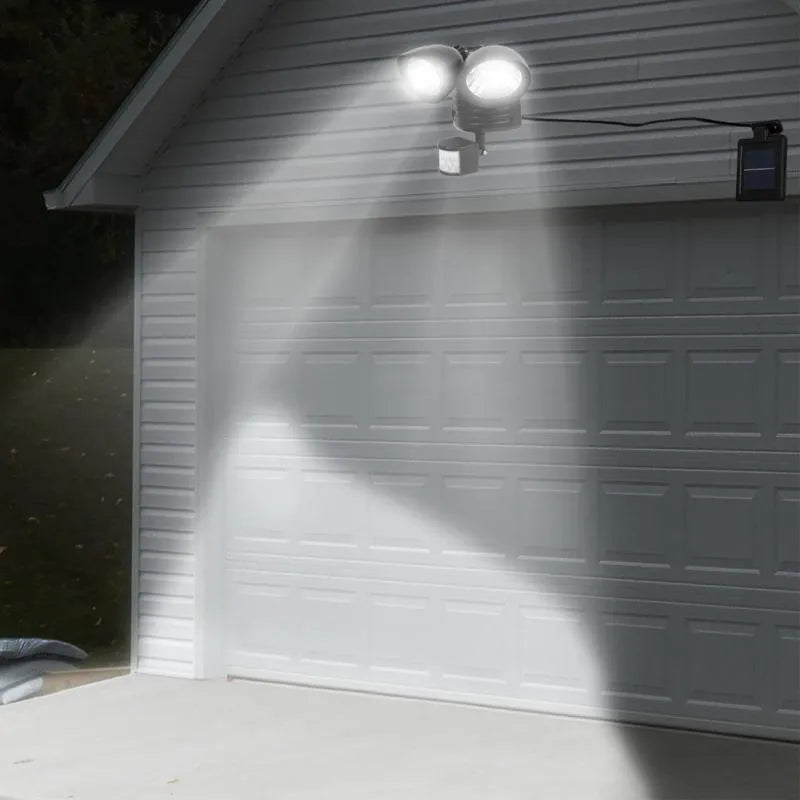Black and white double head solar security spotlight with motion sensor for outdoor installation