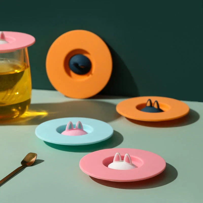 Charming cat ear silicone sealing lid in vibrant colours, designed to keep drinks fresh and prevent spills