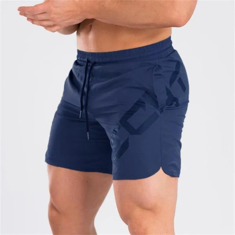 Man wearing black knee-length nylon training shorts with an elastic mid waist.