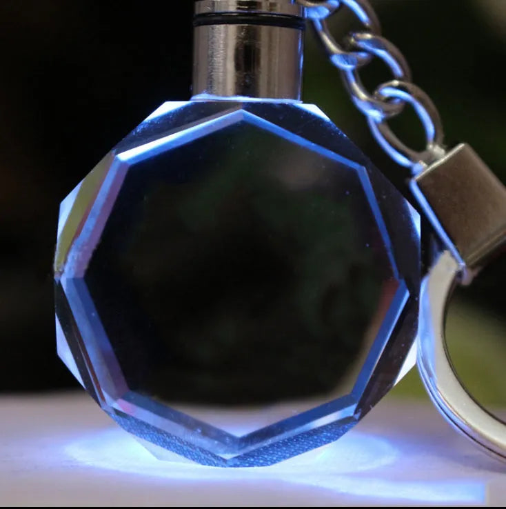 Custom laser-etched crystal photo keychain with internal colourful LED light activated, showing a personalised image.