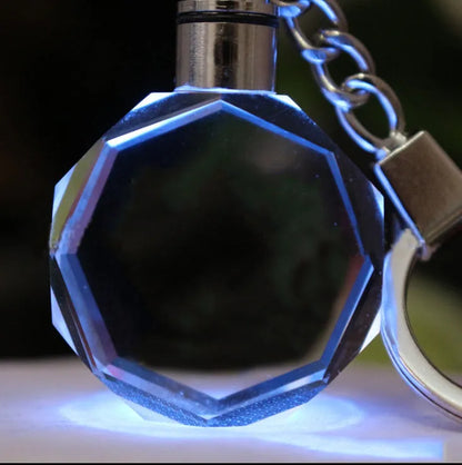 Custom laser-etched crystal photo keychain with internal colourful LED light activated, showing a personalised image.
