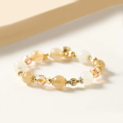 Gold electroplated bracelet with a rutilated quartz charm in Lucky Fortune colour.