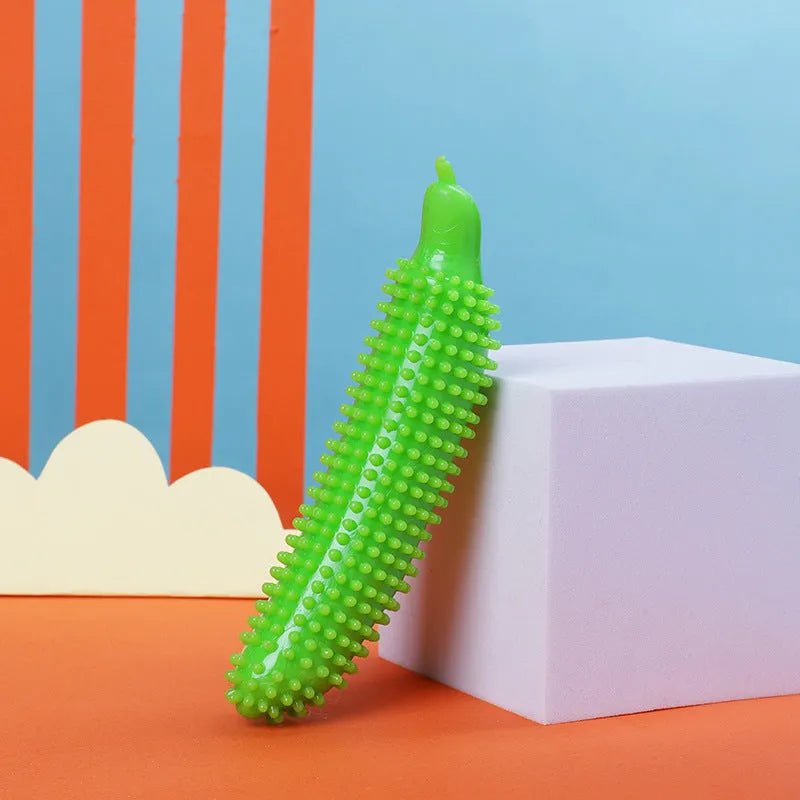 Green cucumber-shaped dog teething chew toy for bite resistance and interactive play.