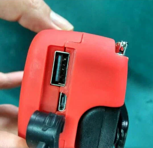 Portable solar and hand-cranked USB charging radio flashlight with LED illumination for outdoor adventures and emergency preparedness