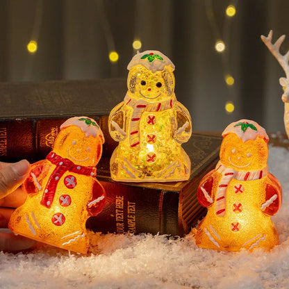 Glowing Christmas gingerbread man and snowman ornaments with LED lights in red, white, and transparent scarf variations
