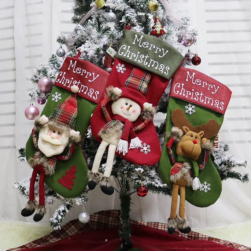 Three Christmas stockings with Santa, Snowman, and Reindeer designs showing 3D appliqué details