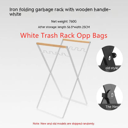 Black outdoor folding trash rack with wooden handle, holding a waste bag.