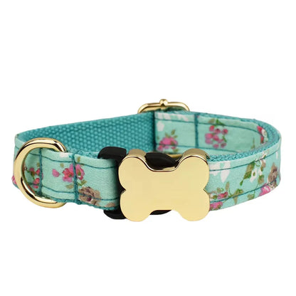 Flat nylon grid print dog collar with a white plastic bone-shaped buckle on a green background.