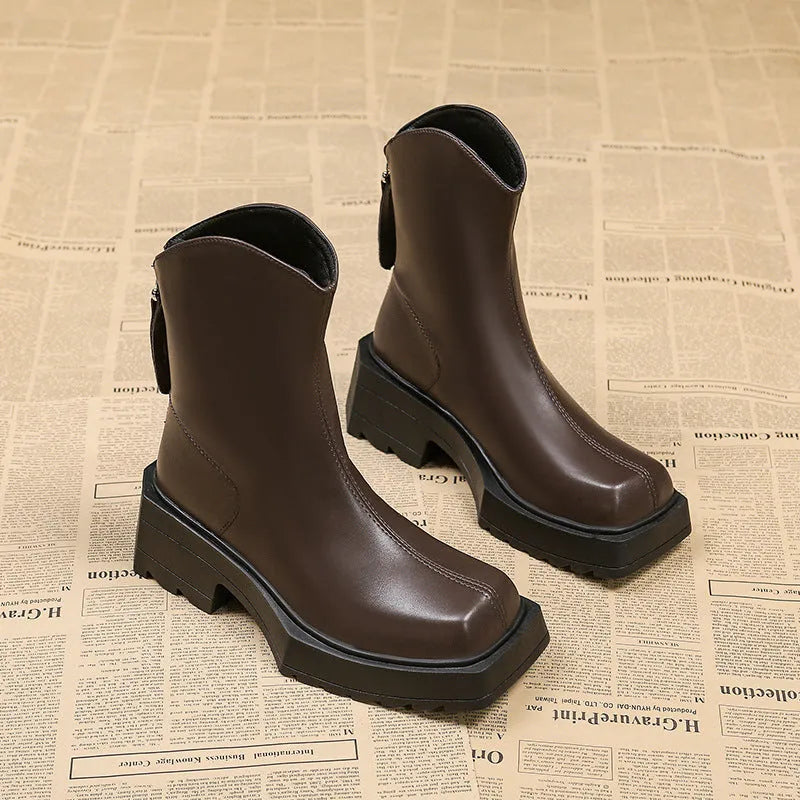 Black platform Martin boots for women with square toe, back zipper, and rubber sole.