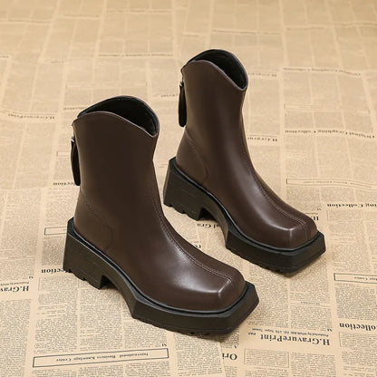 Black platform Martin boots for women with square toe, back zipper, and rubber sole.