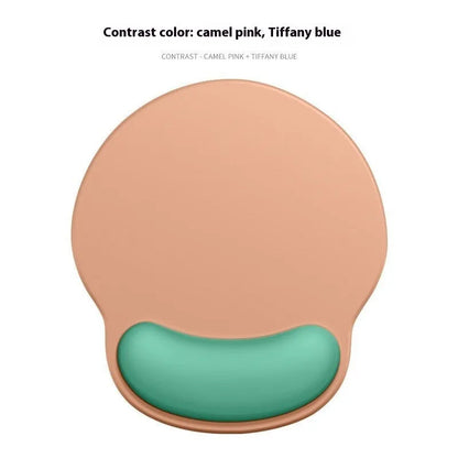 Silicone mouse mat with integrated wrist rest in a gradient blue black colour on a desk.