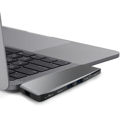 Silver 8-in-1 USB-C card reader hub for MacBook Pro with multiple ports including USB and SD slots.