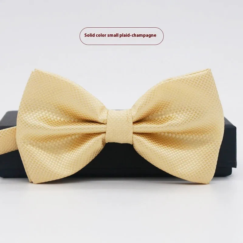 A solid colour pre-tied bow tie with an adjustable neck strap, shown in a classic flat head shape.