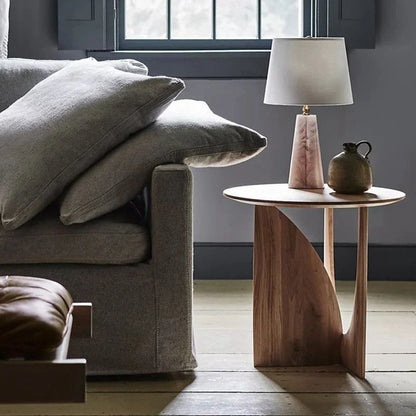 Round solid wood bedside table with geometric legs in walnut finish measuring 50cm diameter