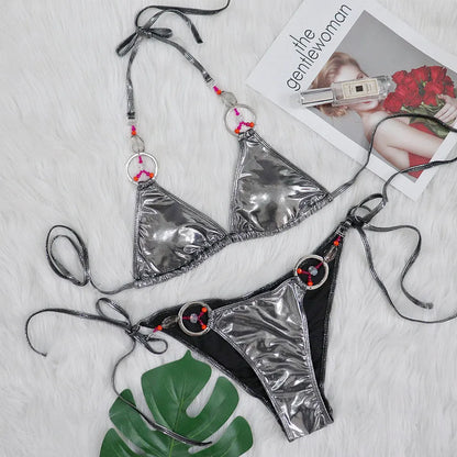 Silver women's bikini swimsuit with split briefs design on mannequin