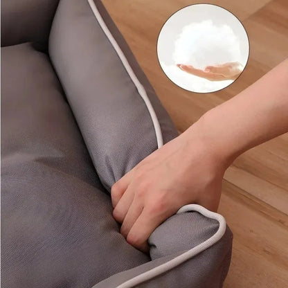 Waterproof dog sofa bed in grey Oxford cloth showing raised sides and rectangular shape