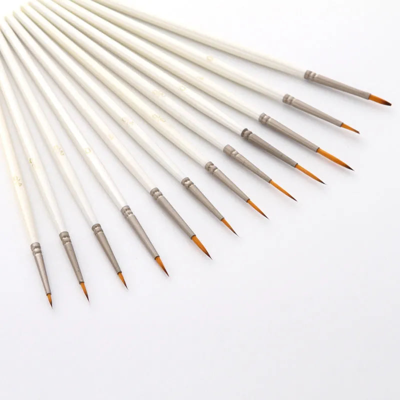 Set of 12 pearl white nylon wool hook line art brushes in a solid wood pen holder.