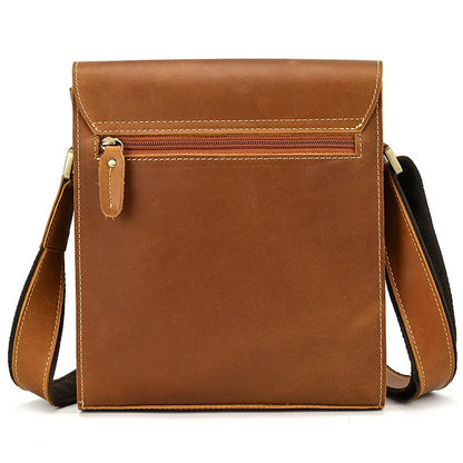 Men's brown first layer cowhide leather shoulder bag with crossbody strap and visible sewing line details.