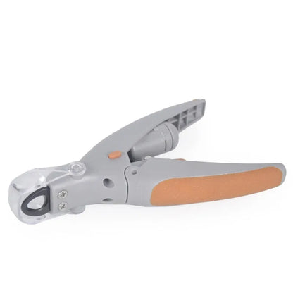 White plastic pet nail clipper with LED light on blister card packaging.