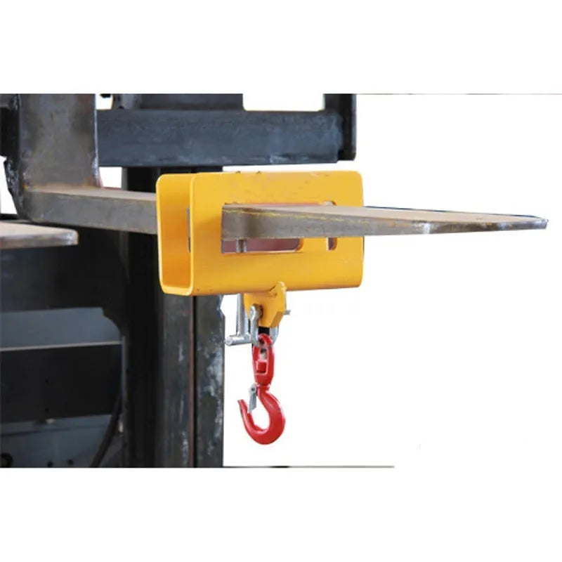Heavy-duty iron forklift hook with rotatable drum and safety locking latch, shown mounted on forklift forks.