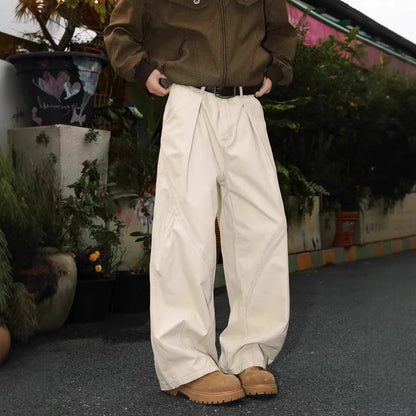 Man wearing pleated straight-leg trousers in a striped pattern with a micro elastic mid waist.