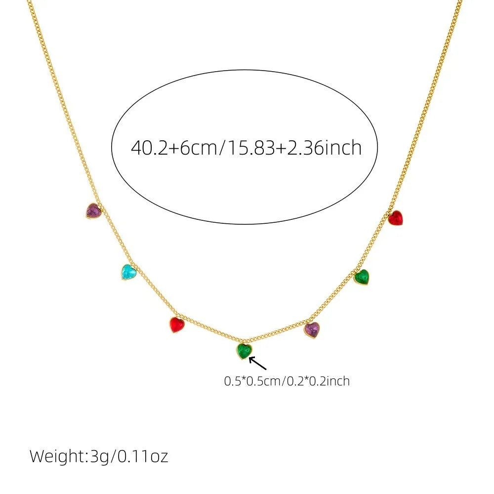 Women's gold-plated heart necklace with adjustable chain on white background