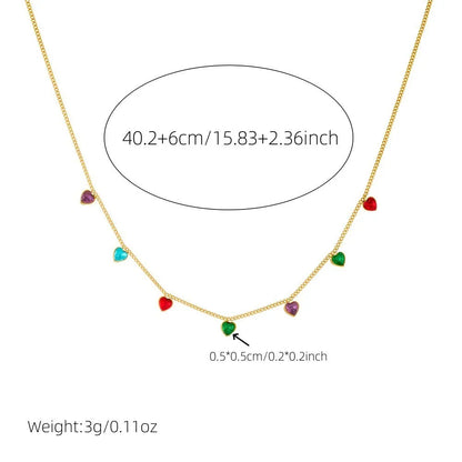 Women's gold-plated heart necklace with adjustable chain on white background