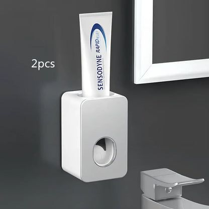 Black wall-mounted automatic toothpaste dispenser with 1 ml pump, punch-free adhesive, 18 cm height for bathroom use