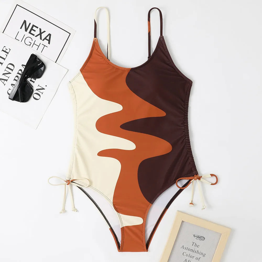 Women's sleeveless one-piece swimsuit in a striped print, shown in blue colour.
