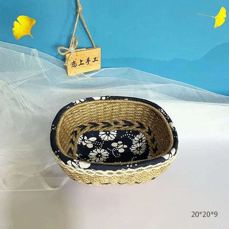 Blue square plastic storage basket with hand-woven sides for organising household items.