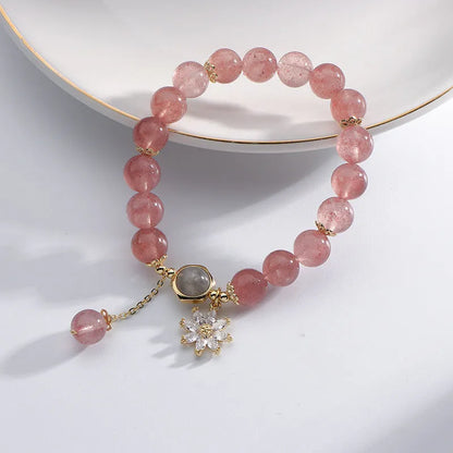 Korean Mori style crystal bracelet with a strawberry quartz bead and floral electroplated metal details