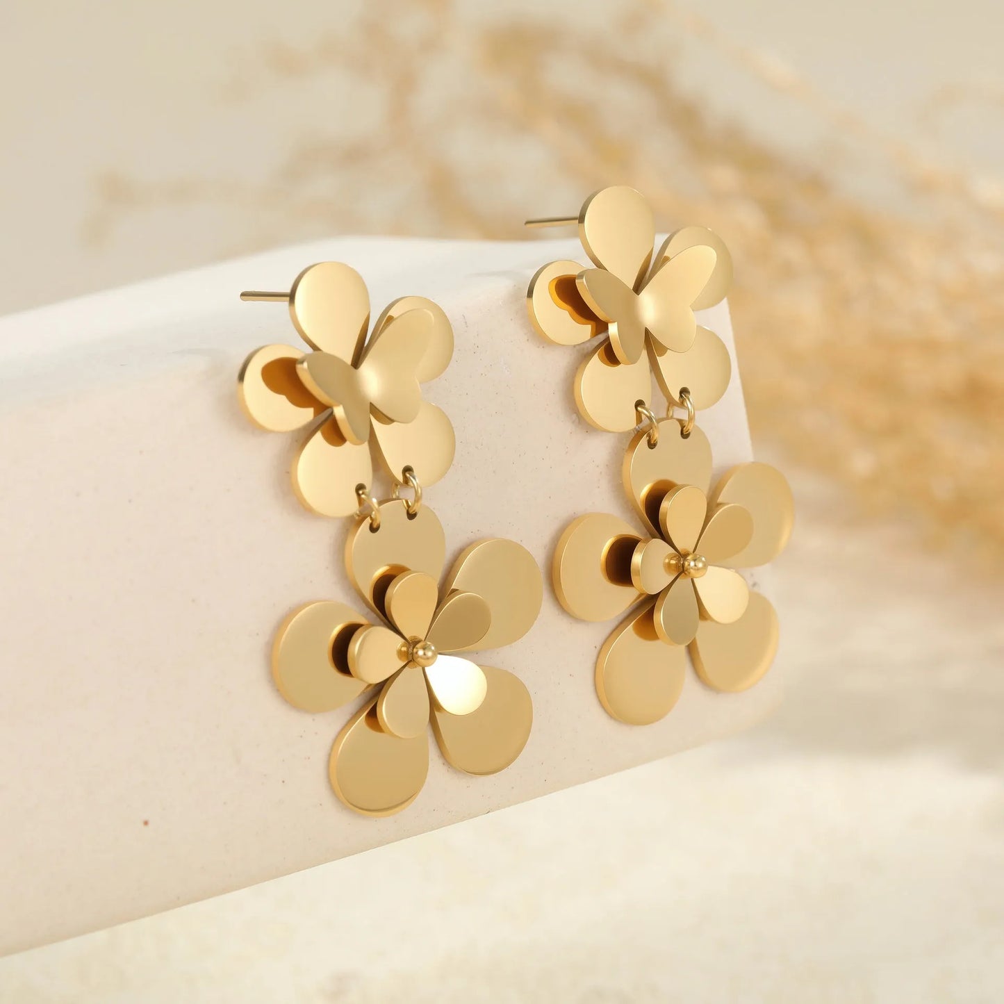 Gold colour flower butterfly stainless steel earrings for women with geometric and zodiac design elements
